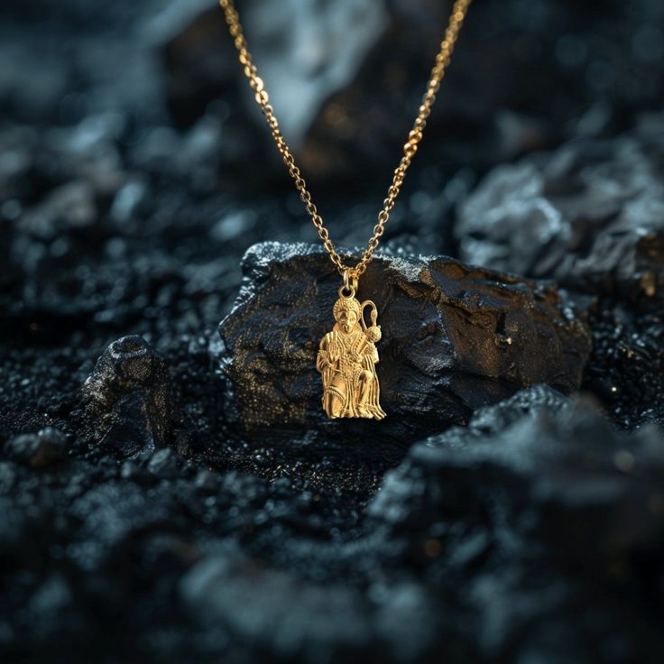 Elevate your faith with our gold Hanuman Pendant, symbolizing devotion and strength in Hinduism. This solid gold Hanuman necklace captures the essence of the Monkey God. Explore our collection of Hanuman-themed jewelry, including elegant gold medallions, perfect for those seeking a unique and meaningful piece of Hindu faith. PENDANT INFORMATIONThis pendant is made of real, solid gold.• Made in USA• Material: 14k or 18k solid gold• Finish: polished• Height: 1.29" (32,5 mm) x Width: 0.67" (17 mm)• Pendant weight: approx. 6 grams (14k)• Bail: fits up to 4 mm chains• Solid back, not hollow• A certificate of authenticity is included• Delivered in our elegant jewelry box, making it the perfect gift Shipping: All of our orders are custom-made. Please allow approximately 3 weeks for production and Yellow Gold Amulet Necklace For Rituals, Gold Plated Spiritual Medallion Jewelry, Gold Mythological Jewelry With Coin Pendant, Gold Mythological Coin Pendant Jewelry, Mythological Style Gold Coin Pendant Jewelry, Spiritual Yellow Gold Coin Pendant, Yellow Gold Amulet Temple Necklace For Rituals, Yellow Gold Temple Necklace For Rituals, Mythological Style Yellow Gold Jewelry As Gift