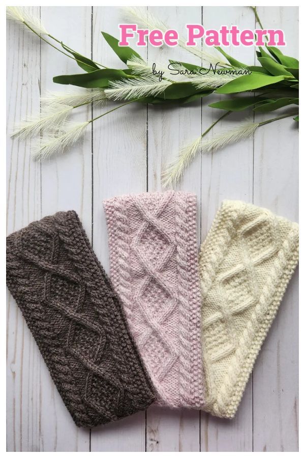 three knitted headbands on top of a white wooden table with green leaves