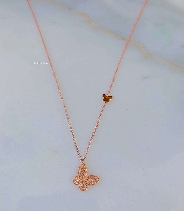 Metal: 14K Rose Gold White and yellow can be ordered. It will take approx. 3 to 4 weeks to make and ship. The same goes for if you are ordering more than 1 rose gold. The 1 rose gold is in stock and will be shipped within 2 days. Stone: Diamond Stone Shape: Round Diamond Weight: .15 ctw Weight of Necklace: 1.83 grams Width of chain: 1.00mm Type of Chain: Rolo Chain Dimensions Of Diamond Butterfly: 10.02mm Long Dimensions Of Plain Butterfly: 5mm Long Type of clasp: Spring Clasp Length of Chain: C 14k Rose Gold Diamond Necklace With Adjustable Chain, 14k Rose Gold Diamond Necklace Gift, Rose Gold 14k Diamond Necklace Gift, Dainty Rose Gold Diamond Necklace Gift, Dainty Rose Gold Diamond Necklace With Accents, Dainty Rose Gold Cubic Zirconia Diamond Necklace, Fine Jewelry Rose Gold Diamond Necklace With Delicate Chain, Rose Gold Diamond Necklace With Delicate 14k Gold Chain, 14k Rose Gold Diamond Necklace With Delicate Chain