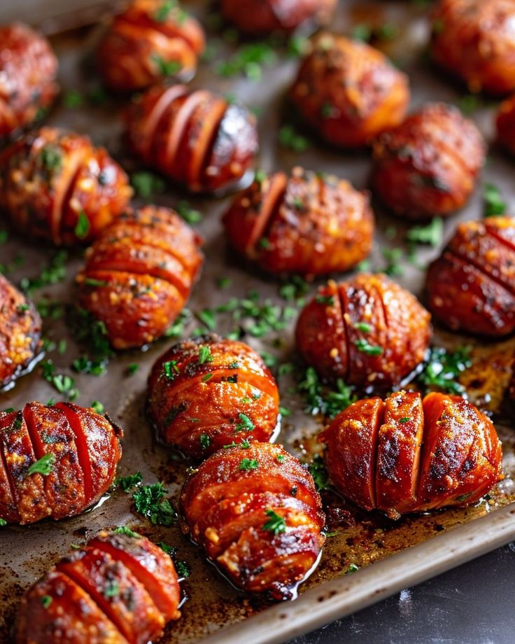 there are many cooked meats on the baking sheet and garnished with parsley