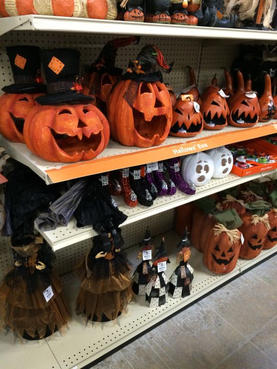 a store shelf filled with lots of halloween pumpkins