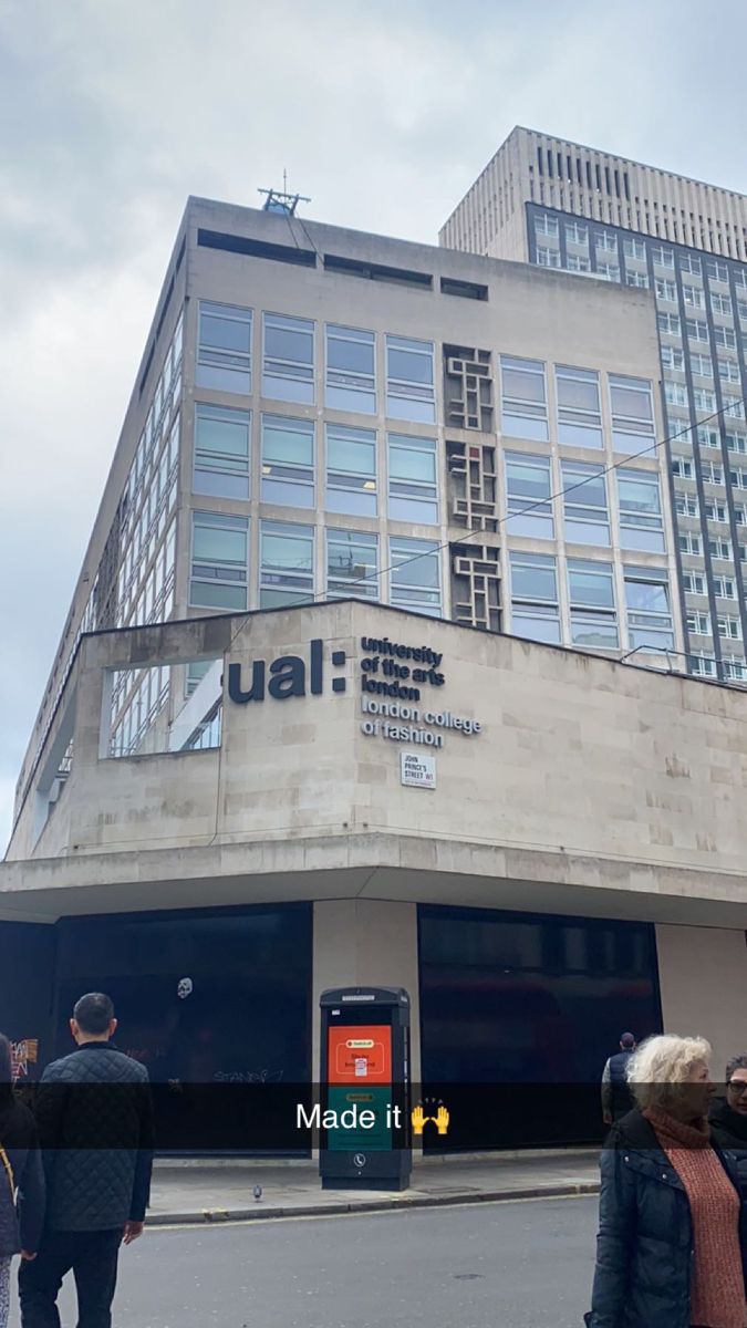 people are standing in front of a building