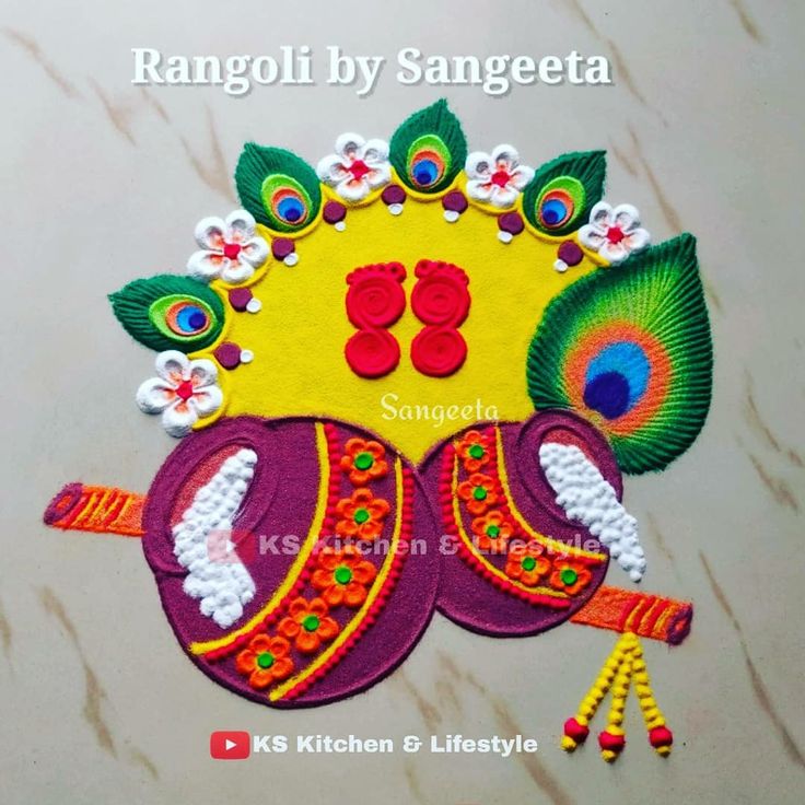 rangoli by sangeetta with peacocks and flowers on the headpiece for diwaling