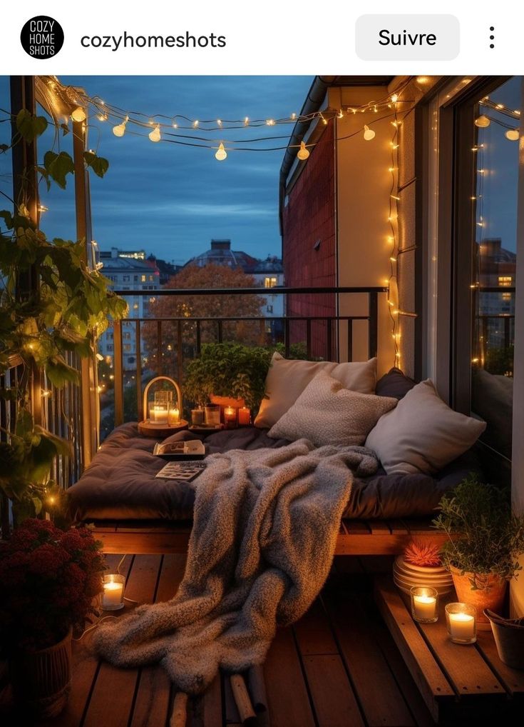 the balcony is decorated with candles and lights for an outdoor space that looks like it could be used as a bed