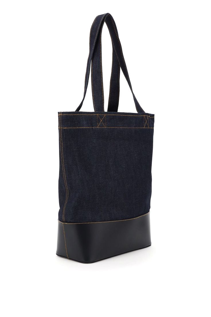 Base: 100% Leather Product: 98% Cotton, 2% Polyurethane | A. P.C. Men's Axelle Denim Tote Bag in Blue | SS24 Jean Touitou, Craft Tote Bag, Denim Tote Bags, Denim Tote, Japanese Denim, Dark Navy Blue, Long Handles, Roberto Cavalli, Luxury Retail