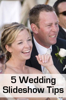 a man and woman sitting next to each other at a wedding