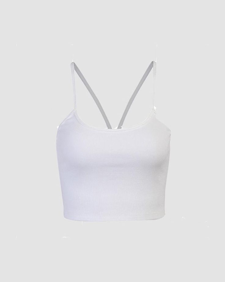 Details: Essential white ribbed topTop Length: CroppedSleeve Length: SleevelessMaterials:95% Polyester + 5% Spandex White Sleeveless High Stretch Crop Top, White Ribbed Scoop Neck Tank Top, White Stretch Cami Crop Top, White Stretch Crop Top With Built-in Bra, White Ribbed Top With Tank Straps, White High Stretch Seamless Crop Top, White Seamless High Stretch Crop Top, White High Stretch Casual Tank Top, White Stretch Tank Crop Top