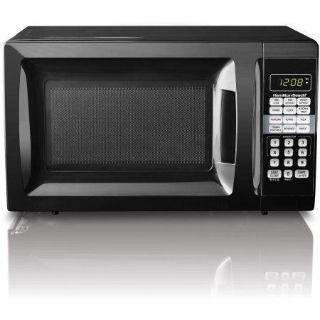 a black microwave oven with the timer on it's side and an open door