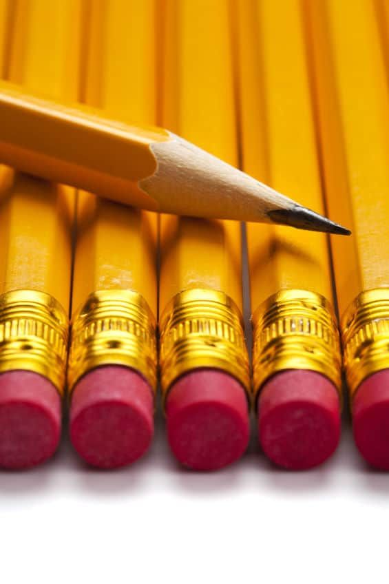 a row of yellow pencils with red ones