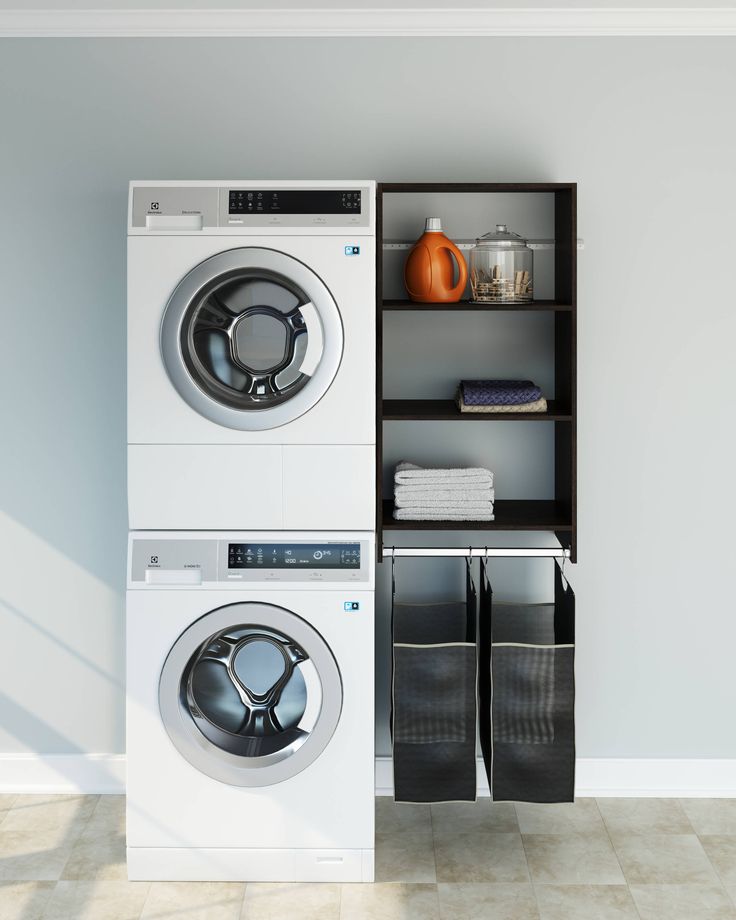 a washer and dryer stacked on top of each other in a laundry room