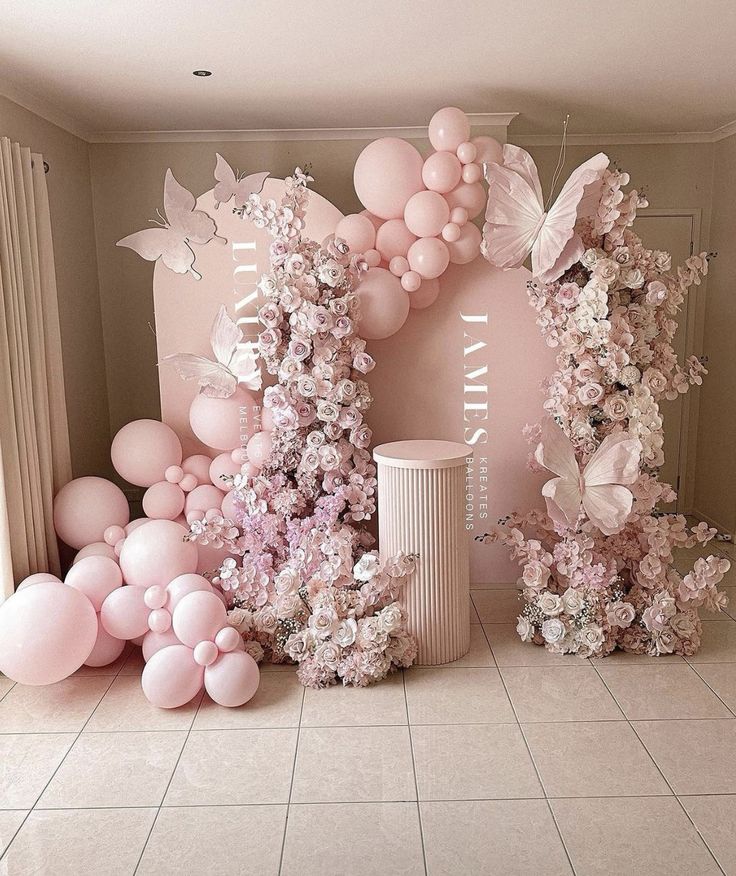 a room with balloons and flowers on the floor