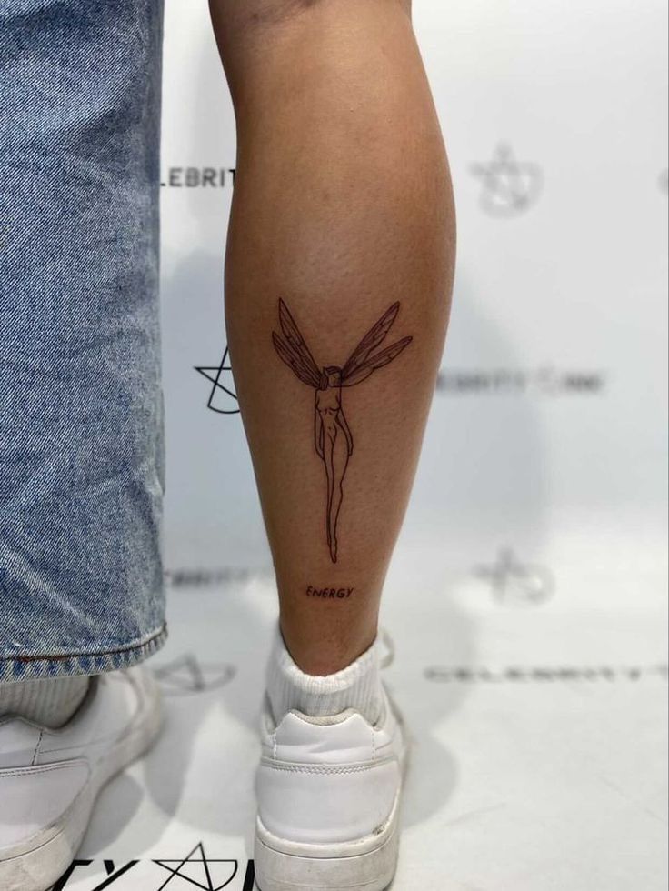 a person with a tattoo on their leg