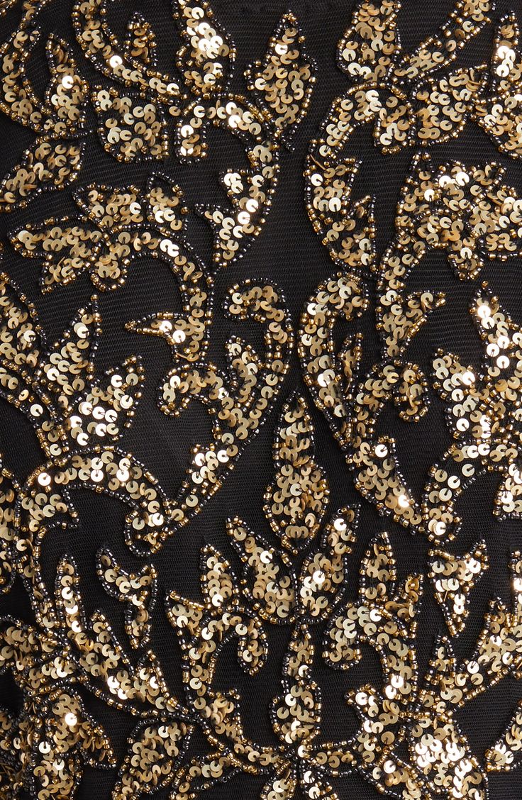 Brilliantly glimmering sequins bring shine to this tie-front dress featuring a mesh bodice and a billowy skirt. 55" length (size 8) Hidden back-zip closure Jewel neck Three-quarter sleeves Tie belt Partially lined 70% polyester, 30% nylon Spot clean Imported Elegant Embellished Sequin Fabric For Gala, Glamorous Embellished Sequin Fabric For Prom, Embellished Sequin Fabric For Prom And Evening Events, Embellished Sequin Fabric For Evening Prom, Sequined Glitter Tulle Evening Dress For Parties, Glamorous Festive Evening Dress With Contrast Sequin, Party Evening Dress In Glitter Tulle With Sequins, Party Evening Dress With Sequins And Glitter Tulle, Elegant Glitter Tulle Evening Dress With Sequins