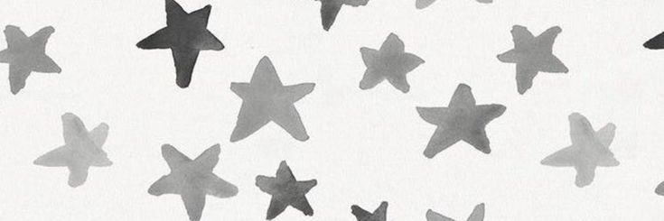 black and white photograph of star shaped objects on the side of a sheet of paper