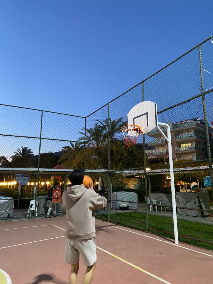 a man is playing basketball on the court