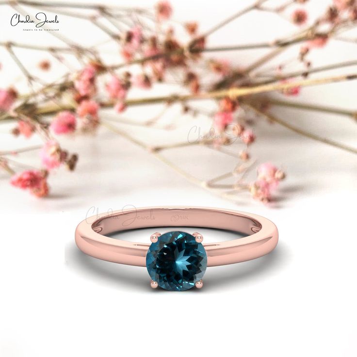 Description This gorgeous London Blue Topaz solitaire ring blends a classic design with a one-of-a-kind gemstone to create a truly stunning ring that will cherish for many years. The solitaire ring has a beautiful 6mm round cut London Blue Topaz in the center that weighs a total of 0.57 carats. London Blue Topaz is a birthstone for December. Rose Gold, Yellow Gold, and White Gold versions of this 14k solid gold ring are available for you. Product Details SKU CJ-R-1349-LBT Product dimension 21.62 Blue Topaz Solitaire Ring Round Cut, Blue Solitaire Topaz Ring Round Cut, Blue Topaz Ring With Center Stone In Round Band, Blue Solitaire Diamond Ring With Round Cut, Classic Blue Topaz Solitaire Ring, Blue Solitaire Topaz Ring With Round Stone, Blue Solitaire Birthstone Ring With Round Band, Blue Solitaire Ring With Round Stone, Blue Solitaire Birthstone Ring