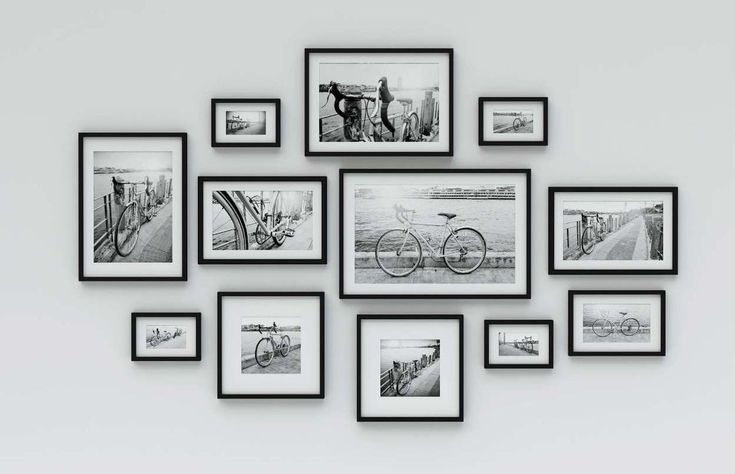 black and white photo frames on the wall with bicycles in them, all hanging up