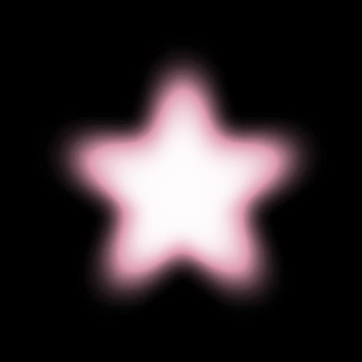 a blurry image of a white star on a black background with the light pink color