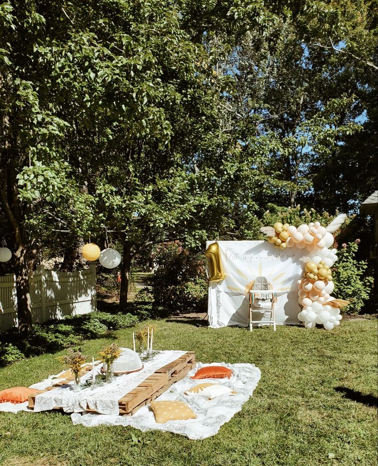 an outdoor picnic with food and decorations