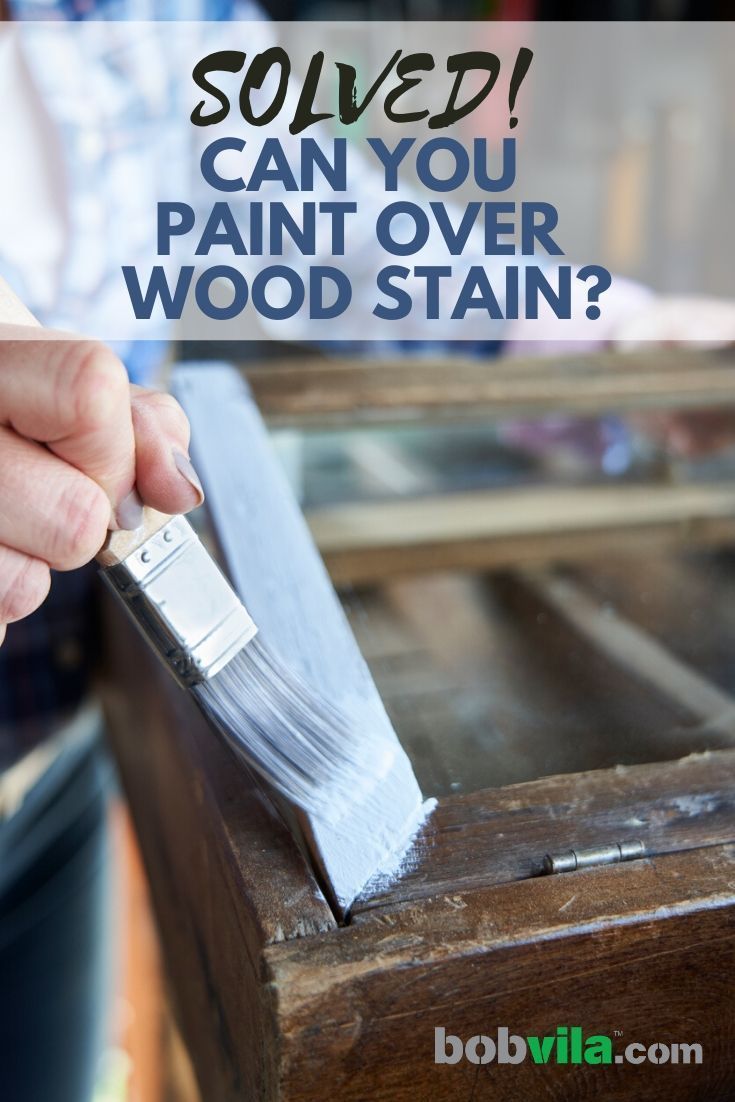 someone using a paint brush to remove wood stain from a piece of furniture with text overlay that reads, sowed can you paint over wood stain?