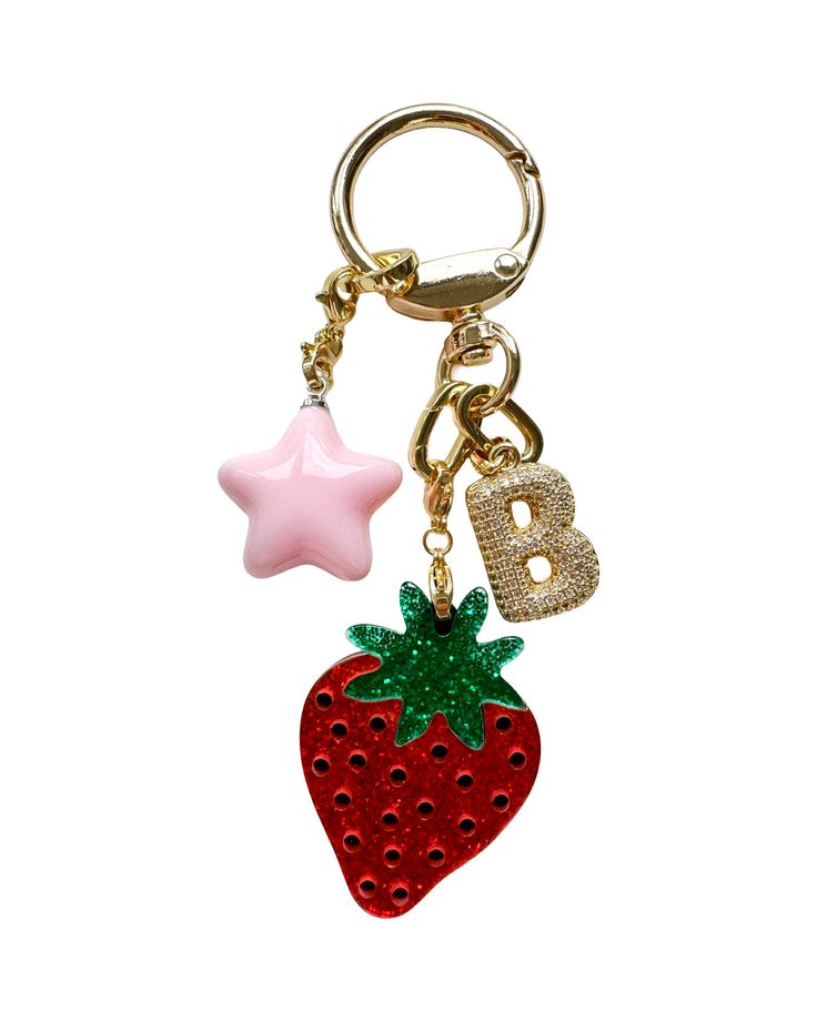 You've likely seen this viral bag charms content all over the internet -- as well as in ELLE, Who What Wear & The Wall Street Journal to name a few. We're excited to introduce this limited-edition STRAWBERRY GIRL KEYCHAIN that is so darling that you will want to attach to all of your precious belongings. Featuring a cutesy strawberry charm and a bubbly pink star charm. Your choice to add a Blingy Bauble initial to level up! So perfect as a personalized gift. Find the other charm options here. A Xmas Gift For Friends, Pink Girly Gifts, Trendy Accessories 2024, Backpack Keychains Aesthetic, Cute Car Keys Keychains Ideas, Victoria Secret Keychain, Key Chains Aesthetic, Car Keys Keychain Ideas, Y2k Gifts