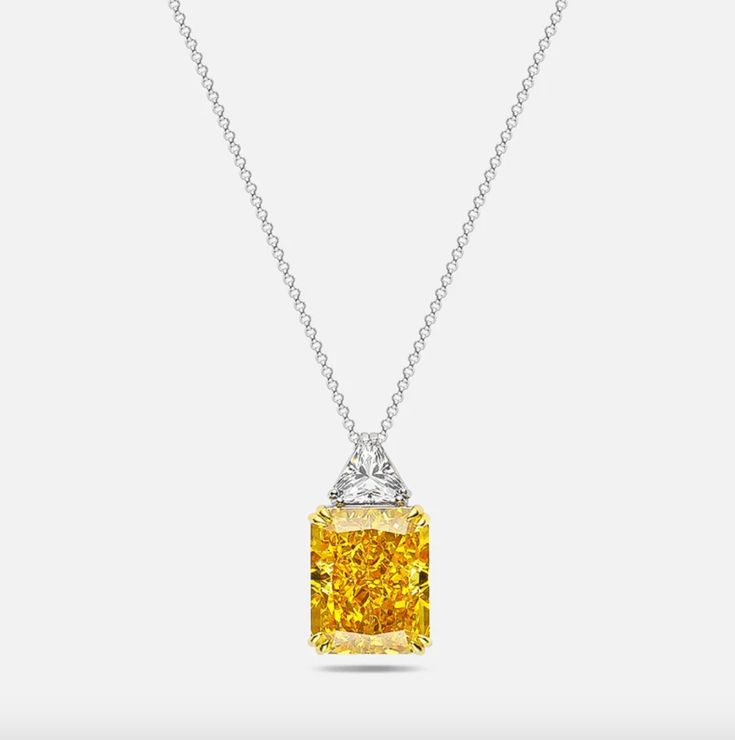 Our divine radiant cut fancy yellow pendant. This necklace makes an exceptional gift. Pendant Details: Stone style: Radiant Cut Stone colours: Fancy Yellow Stone Size: 13mm x 16mm Setting: 925 Sterling Silver Chain, Golden Prongs Occasion: Bridal, Black Tie, Everyday Elegant Emerald Cut Yellow Jewelry, Elegant Yellow Emerald Cut Jewelry, Yellow Gold Necklace With Radiant Cut Prong Setting, Yellow Gold Radiant Cut Necklace With Prong Setting, Yellow Diamond Baguette Cut Jewelry, Yellow Baguette Cut Diamond Jewelry, Yellow Gold Radiant Cut Necklace, Yellow Gold Radiant Cut Necklace For Formal Occasions, Radiant Cut Yellow Gold Necklace For Formal Occasions