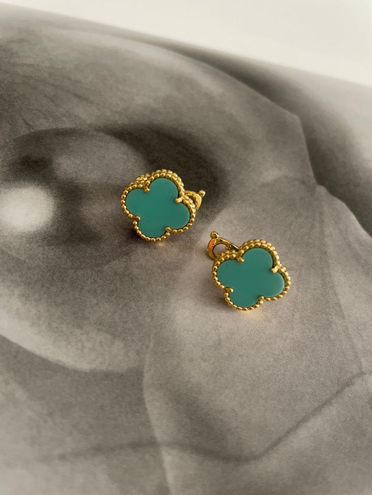 The Clover Earrings bring a classic touch of style to any look. Show off your beautiful earrings with their timeless clover design for an instantly chic style. Elegant Green Flower Earrings Nickel Free, Chic Green Earrings, Elegant Turquoise Flower Earrings Nickel Free, Elegant Turquoise Nickel-free Flower Earrings, Chic Green Earrings For Gift, Elegant Turquoise Clip-on Earrings, Green Hypoallergenic Flower-shaped Earrings, Elegant Turquoise Pierced Earrings, Hypoallergenic Green Flower-shaped Earrings