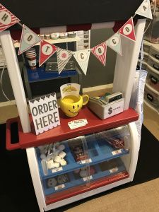 an assortment of items displayed on a shelf in a room with other items and decorations