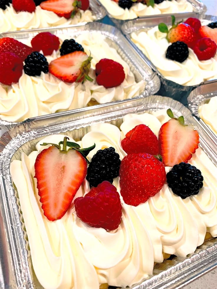 four trays filled with different types of dessert