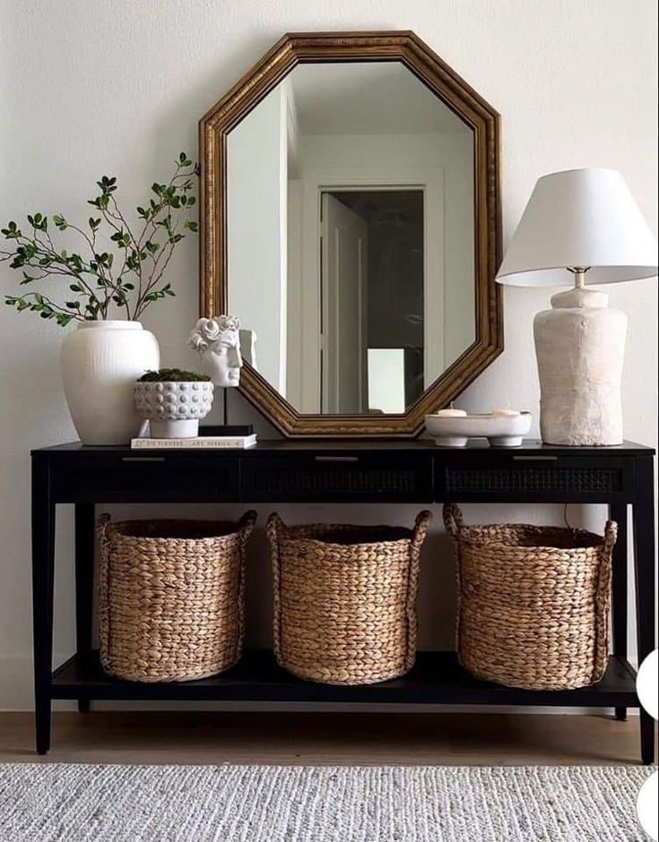 a mirror and some baskets on a table