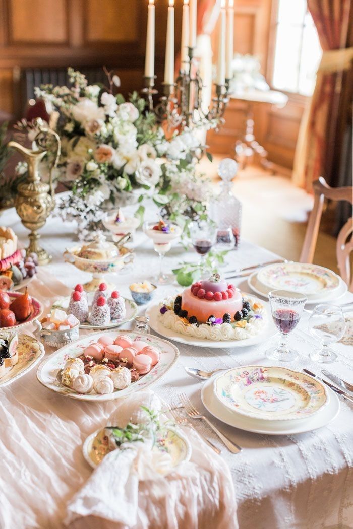 a table is set with plates and cakes