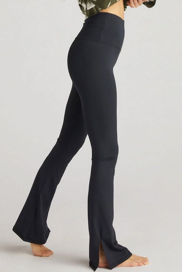 The Strut-This Beau Pant is full-on flattering, with a high-rise waist, flared leg, and slits up the side. Made from their popular Core fabric, these pants will contour every shape while remaining breathable and comfortable. High-rise, full-length legging with contour shaping fit. 25"-28" inseam with stretch. Mid-to-High Compression Breathable Double-Knit Construction 4-Way Stretch Sweat Wicking Durable & Long-Lasting Why we love: such a flattering fit!Fabric: 76% Polyester, 24% Spandex Care: Wa Cheap Fitted Straight Leggings, High Waist Black Leggings, Luxury Compression Bottoms For Yoga, Luxury Full Length Sleek Leggings, Cheap Black Gym Pants, Luxury Tight Full Length Bottoms, Luxury Stretch Full Length Pants, Strut This Leggings, Yoga Pants Outcit