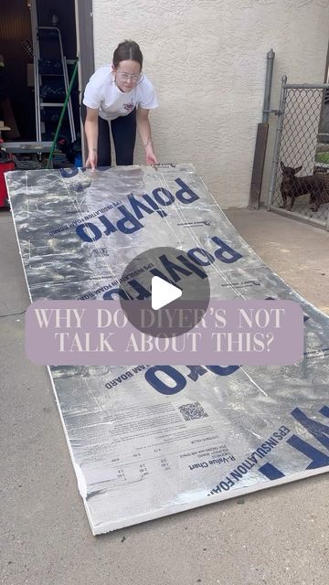 a woman standing on top of a giant piece of cardboard with the words, why do you think it's not talk about this?