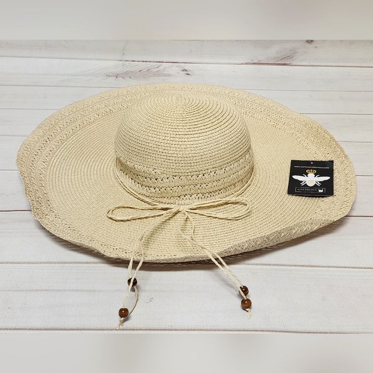 *New With Tags *Inner Band: Approx. 18.5" *Brim: Approx. 5.31"W *Crown: Approx. 4.72"H *Fit: Fitted: Slightly More Relaxed Than A Close Fit; Still Outlines Figure But Not Tightly *Content: 100% Paper *Fabrication: Woven Paper Straw *Embellishment/Trim: Braided Self-Fabric Tie Around Base Of Crown With Beaded Ends *Style: Floppy Sun Hat *Crown: Round *Brim: Wide, Flat Floppy *Interior: Grosgrain Fabric Headband *Stay Away From The Rays In This Oversized Straw Hat, Featuring A Wide, Floppy Brim Pe Lightweight Beach Hat For Beachwear, Lightweight Beachwear Hat For Beach, Adjustable Hats For Beach Vacation, Adjustable Beach Hats For Vacation, Casual Adjustable Hat For Beach Season, Adjustable Casual Straw Hat For Beach, Lightweight Adjustable Hat For Beach, Casual Adjustable Straw Hat For Beach, Casual Adjustable Straw Hat For The Beach