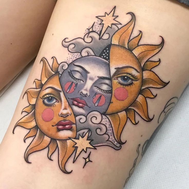 a woman's thigh with two sun and moon tattoos on her legs, both showing their faces