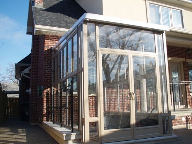 a house with large glass doors on the outside