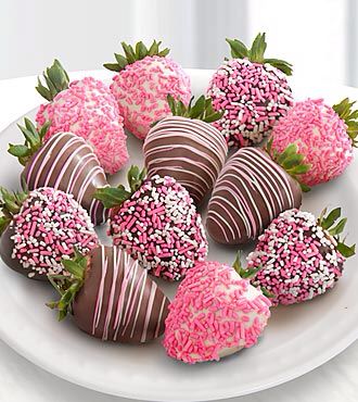 chocolate covered strawberries on a plate with sprinkles