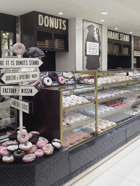 there are many donuts on display in the store