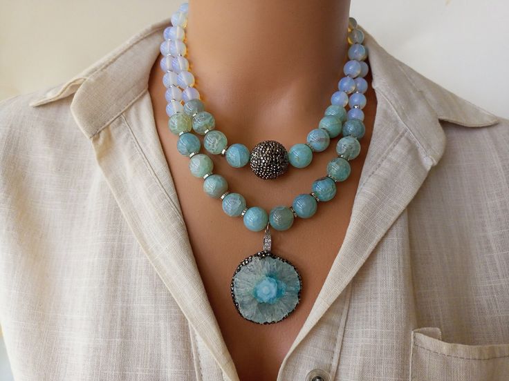 Introducing our stunning Moonstone and Blue Agate Big Beaded Necklace, a true standout piece in our collection of Handmade Chunky Statement Jewelry. This eye-catching necklace is perfect for adding a pop of color to any outfit and makes a thoughtful Summer Gift for both yourself and your beloved mom. Each bead is carefully selected and strung by hand, creating a unique and luxurious accessory that is sure to turn heads wherever you go. MATERIALS: This beautiful necklace is crafted with high-qual Multicolor Agate Necklaces With Large Beads, Blue Agate Beaded Necklaces, Luxury Blue Agate Beaded Necklaces, Blue Agate Polished Beads Necklace, Large Bead Necklace, Luxury Hand-strung Agate Beaded Necklaces, Bold Statement Jewelry, Moonstone Beads, Summer Gift