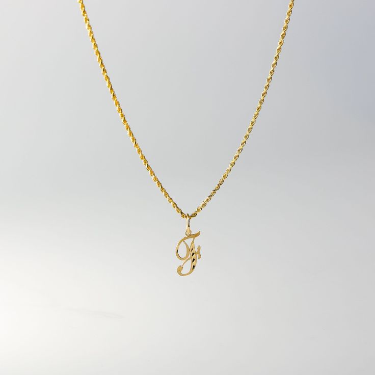 A timeless piece that will never go out of style. This 14K gold calligraphy pendant is the perfect and most stunning way of keeping a name close to your heart. We handmade each piece so you can assure you're getting a one-of-a-kind pendant that is not like any other. This 14K solid gold letter pendant is flawlessly crafted to look super chic and elegant around your neck. Pair it with a nice gold chain and wear it with almost all of your outfits. The piece is such a versatile lettering necklace. F Necklace, F Initial, G Necklace, G Initial, Gold Letter Pendants, Initial F, Initial G, Crystals Necklace, Pretty Jewelry Necklaces