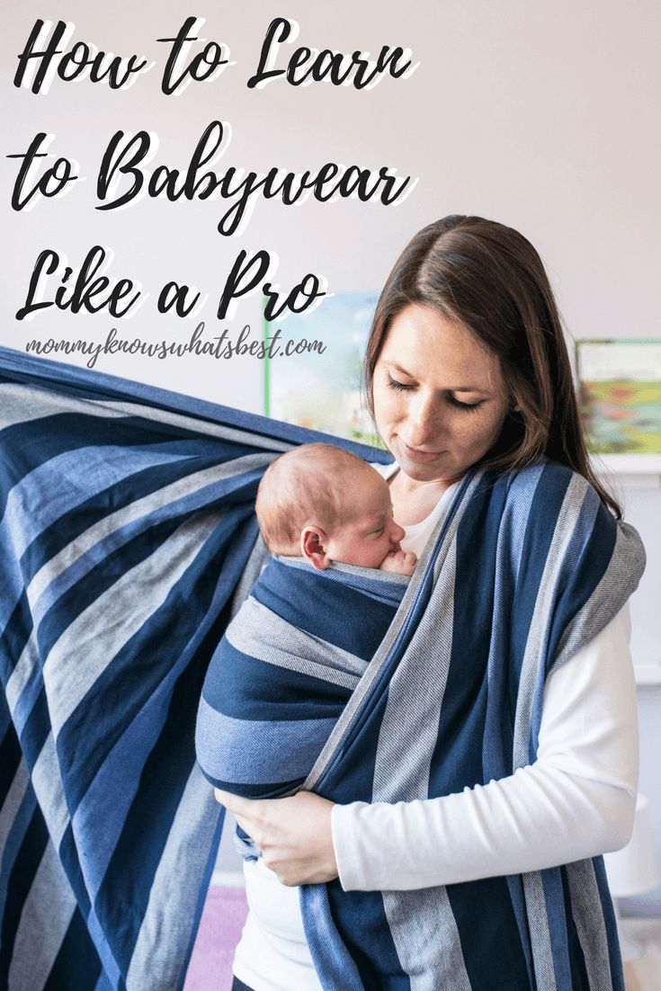 a woman holding a baby wrapped in a blue and white blanket with text overlay how to learn to babywear like a pro