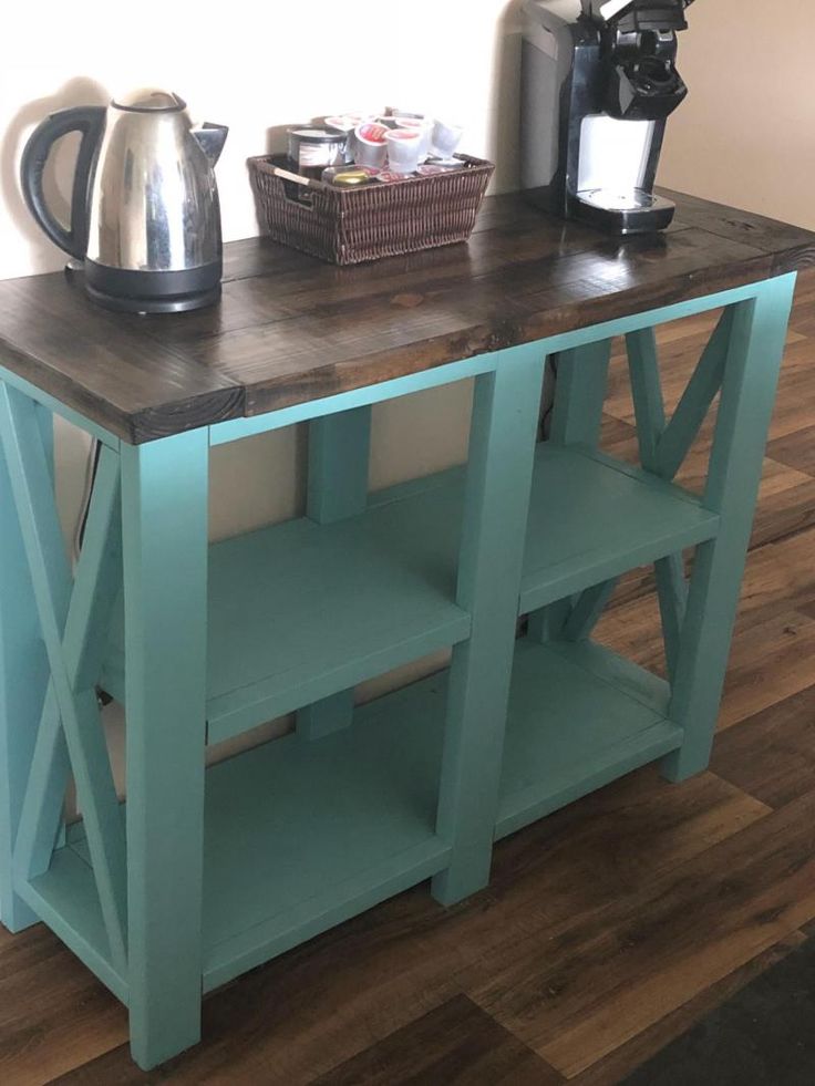 a wooden table with a tea kettle on top