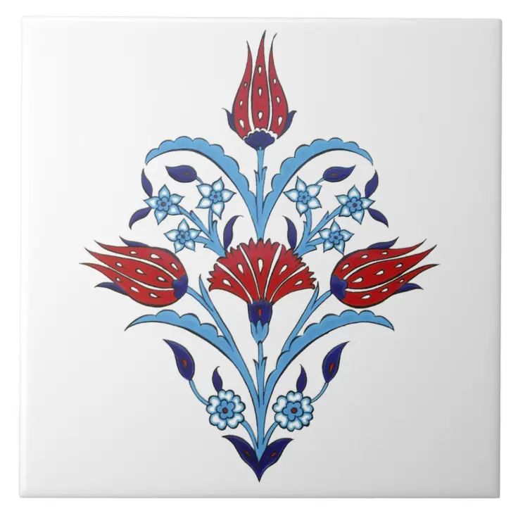 a white tile with blue and red designs on it