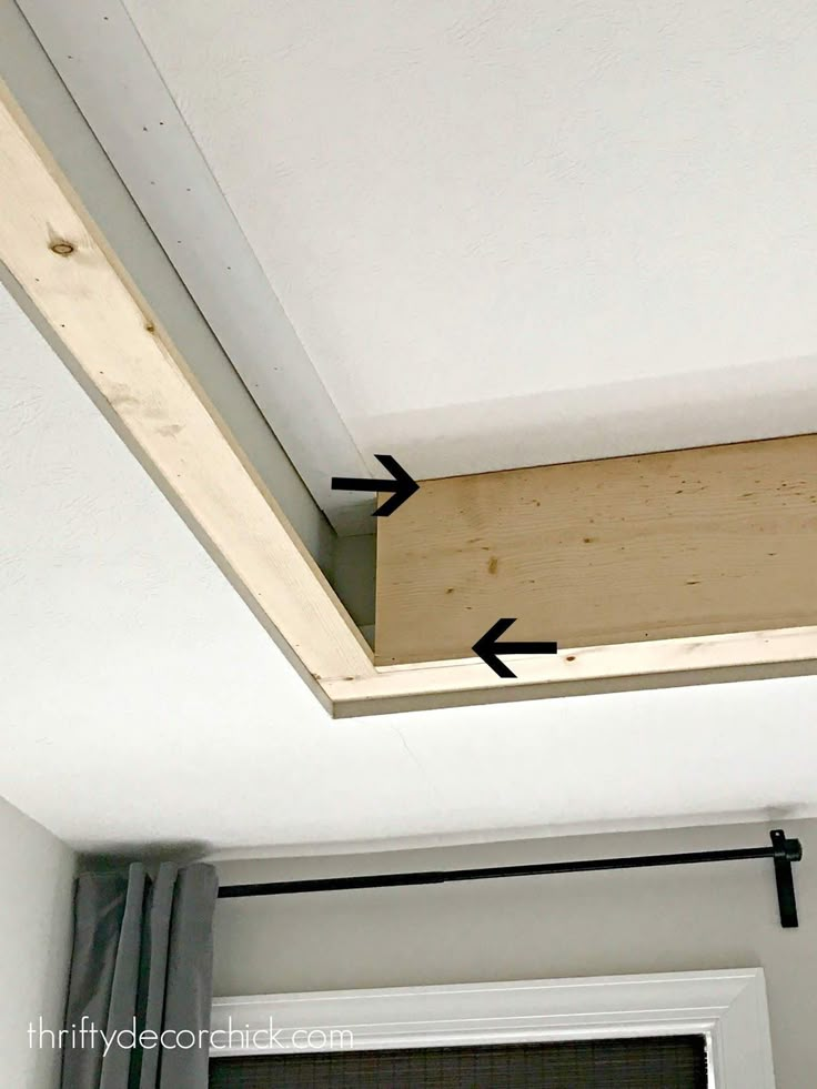 an overhead window with two black arrows pointing upward