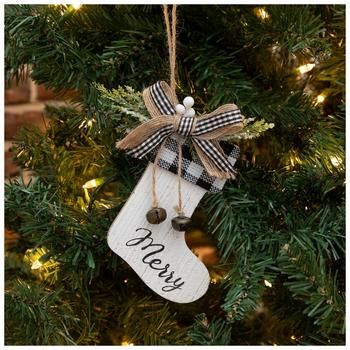 an ornament hanging from a christmas tree with the word merry written on it