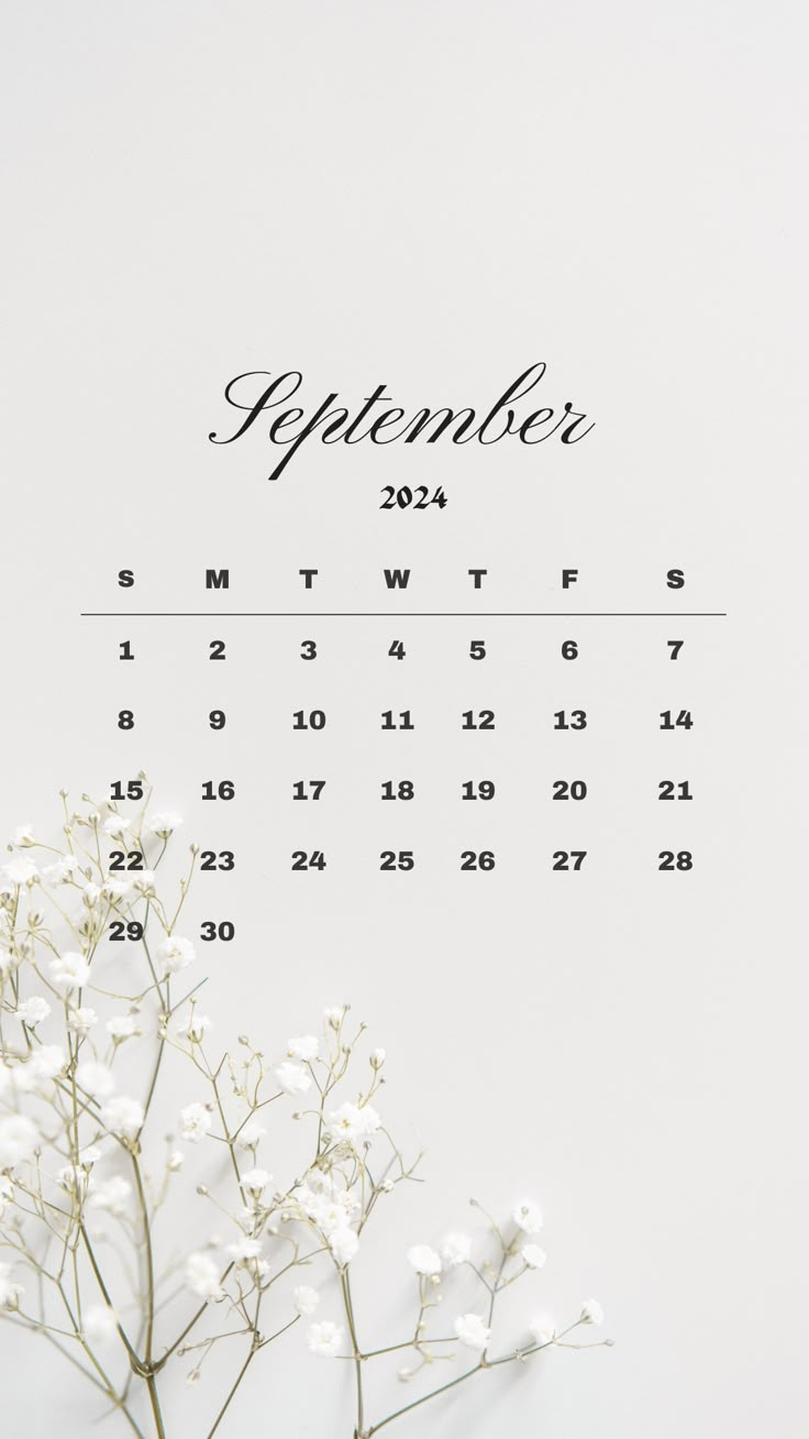 a calendar with white flowers in front of it