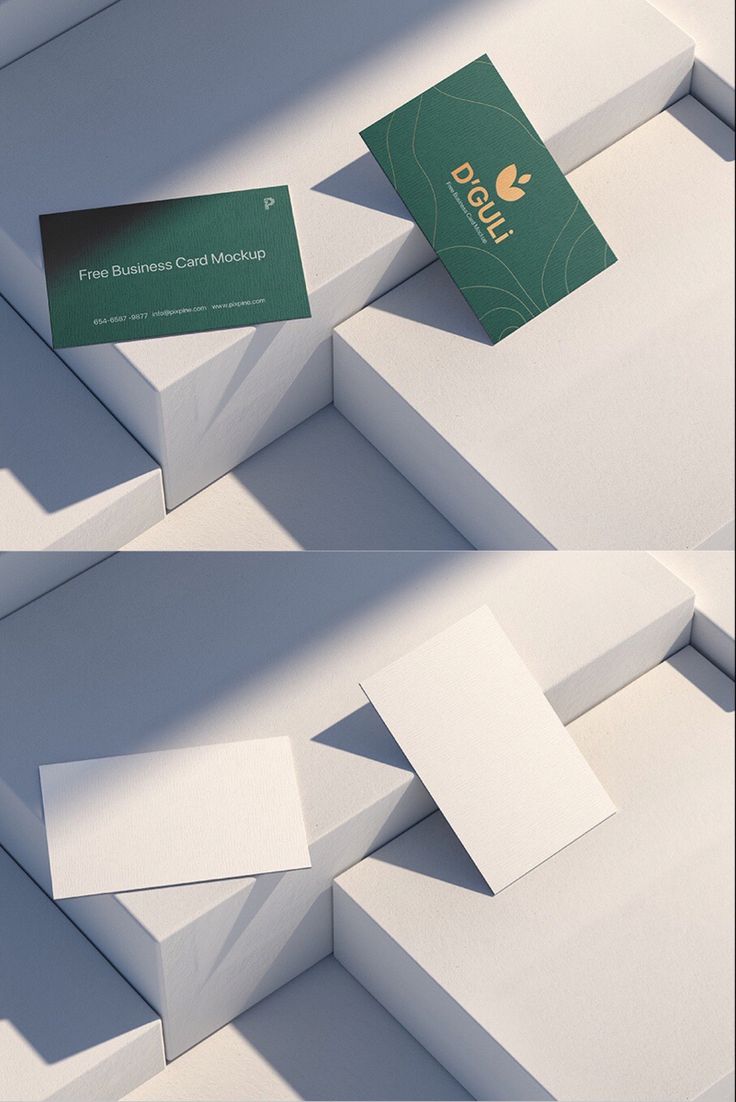 the business card is placed on top of some white boxes with different shapes and sizes