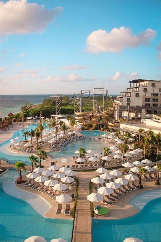 an aerial view of the resort and pool area