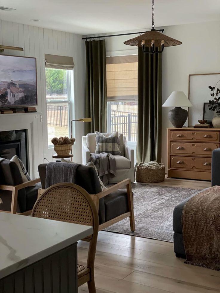 a living room filled with furniture and a fire place