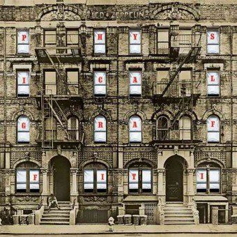 an old building with many windows and steps on the front, next to a fire escape